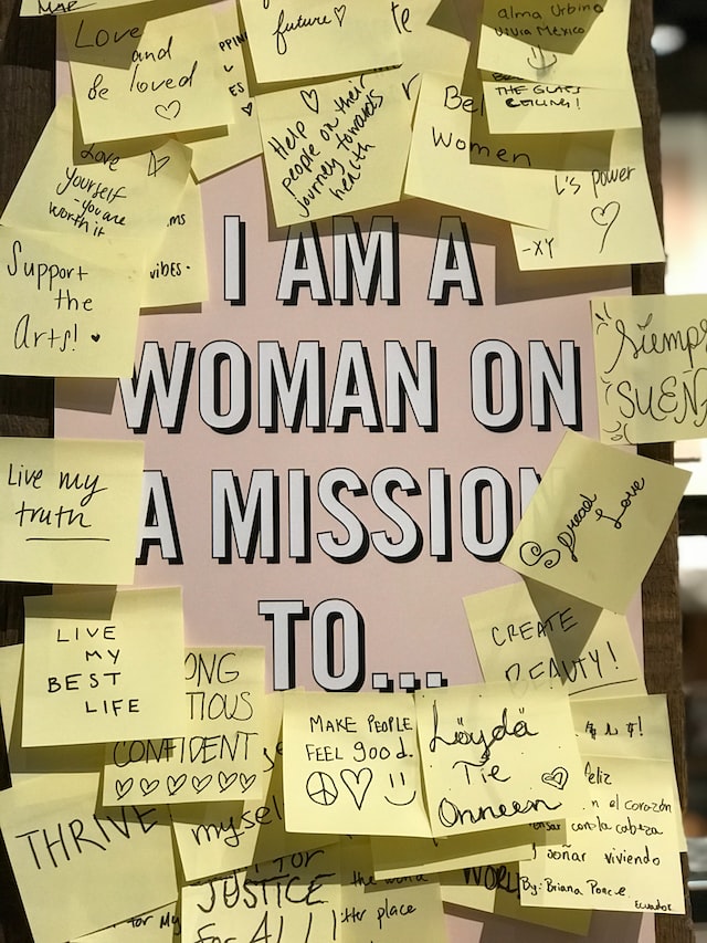 Various messages are written on post-it stickers telling everyone that the woman is on a mission to o bring equality in the society